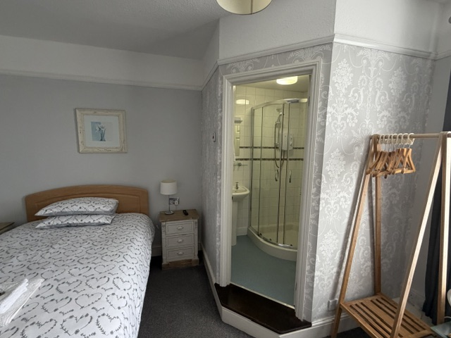 A Large en-suite double room, with the bathroom visible through the doorway